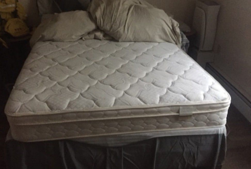 Full size bed with box with steel frame support.
