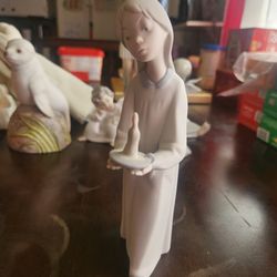 Lladro Young girl holding a candle porcelain figure
