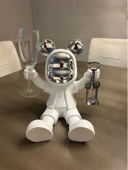Modern white bear with wine opener