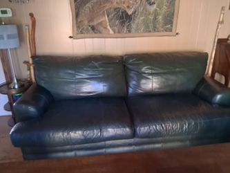 Dark green leather couch and love seed