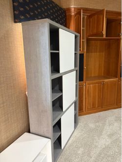 Two Tall 8’ cabinet with sliding doors. 47” wide, 14” deep, 76” tall each