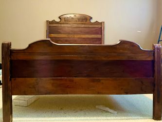 Victorian or Eastlake period about 1870’s 1880’s , this full or double size bed was hand carved of solid walnut with matched burl panels