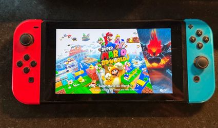 Nintendo Switch (Gen 1) with Two Docking Stations, Power Cable, 2 HDMI Cables + Super Mario 3D World Game Cartridge