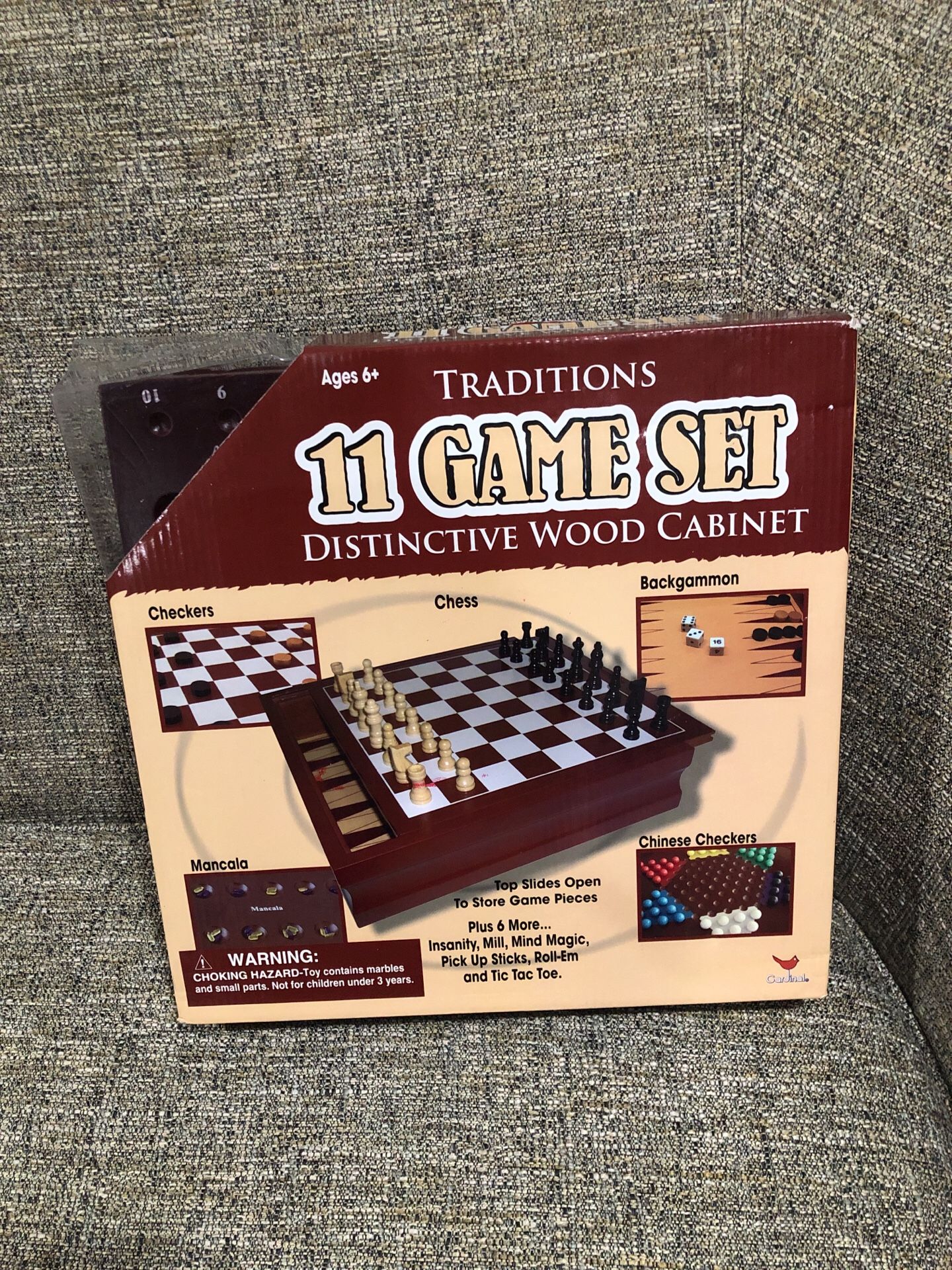 11 Game Set Distinctive Wood Cabinet. Please see all the pictures and read the description