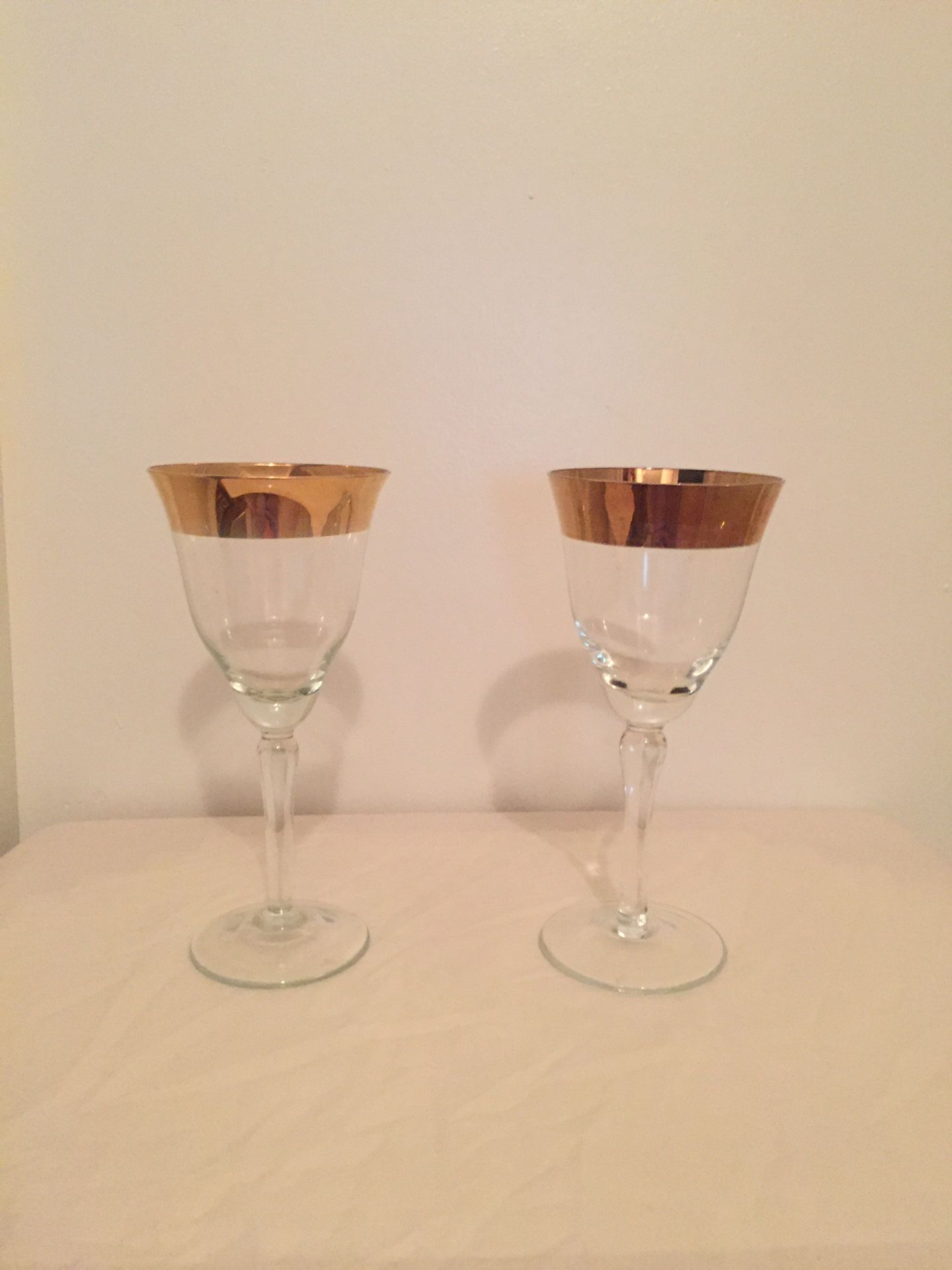 Antique glass wine goblet set with gold trim