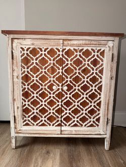 Distressed Wood Cabinet with Lattice Doors