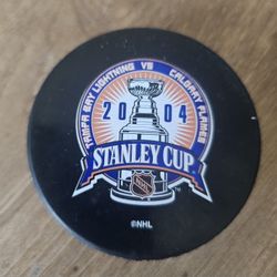 2004 Stanley Cup Finals Puck - Tampa Bay Lightning vs Calgary Flames - NHL Collectible commemorative hockey puck from the 2004 Stanley Cup Finals