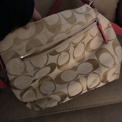 Coach purse with pink Straps 