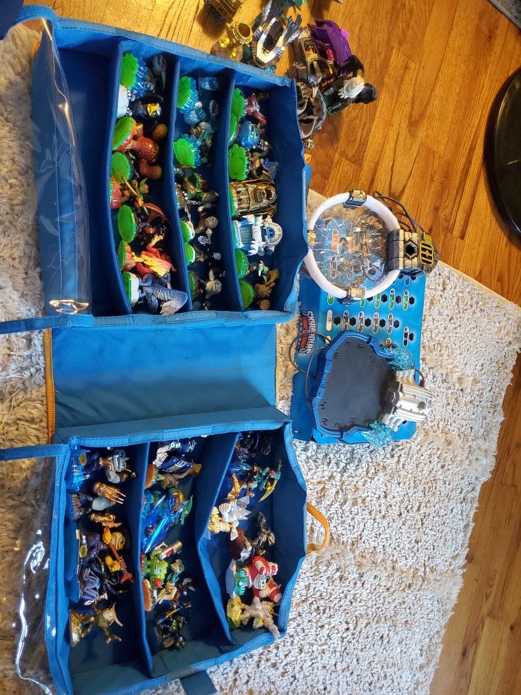 Skylander Figures + Portal + Case