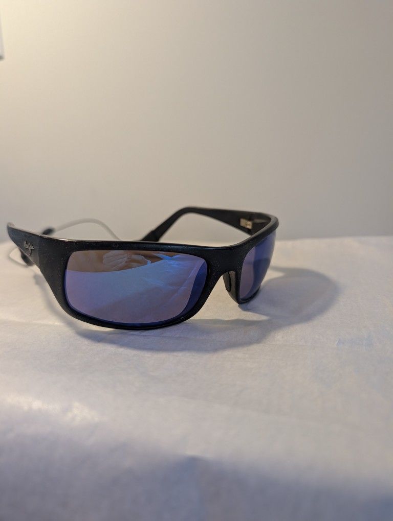 Maui Jim Peahi polarized sunglasses with a black matte frame and blue mirror lenses.