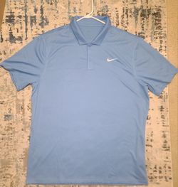 Microfiber polyester light blue short-sleeve Nike Dri-FIT polo shirt, designed primarily for golf or tennis. Nike's signature Dri-FIT technology, high