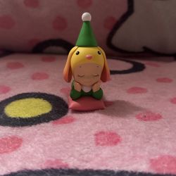 sonny angel christmas santa’s little helper series - Lop ear rabbit laying down
