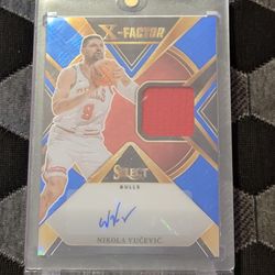 2023-24 Panini Select #XFS-VUC Nikola Vucevic X-Factor Signatures Blue #/49