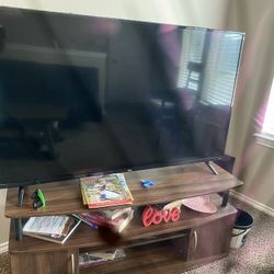 Table, TV, Folding Couch( Turn to bed), TV Stand Modern. 