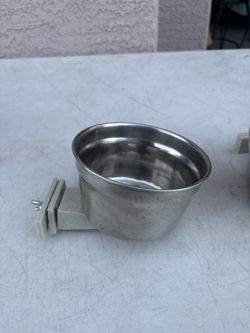 Two Stainless Pet Water Or Feed Bowls That Attach To Crates