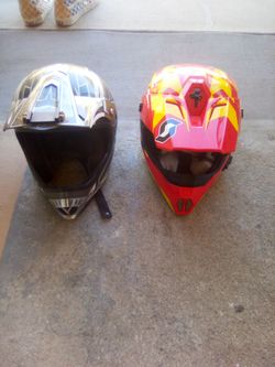 Two large motorcycle helmets