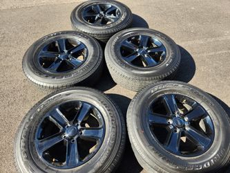 18" Jeep Wrangler black factory wheels and tires 