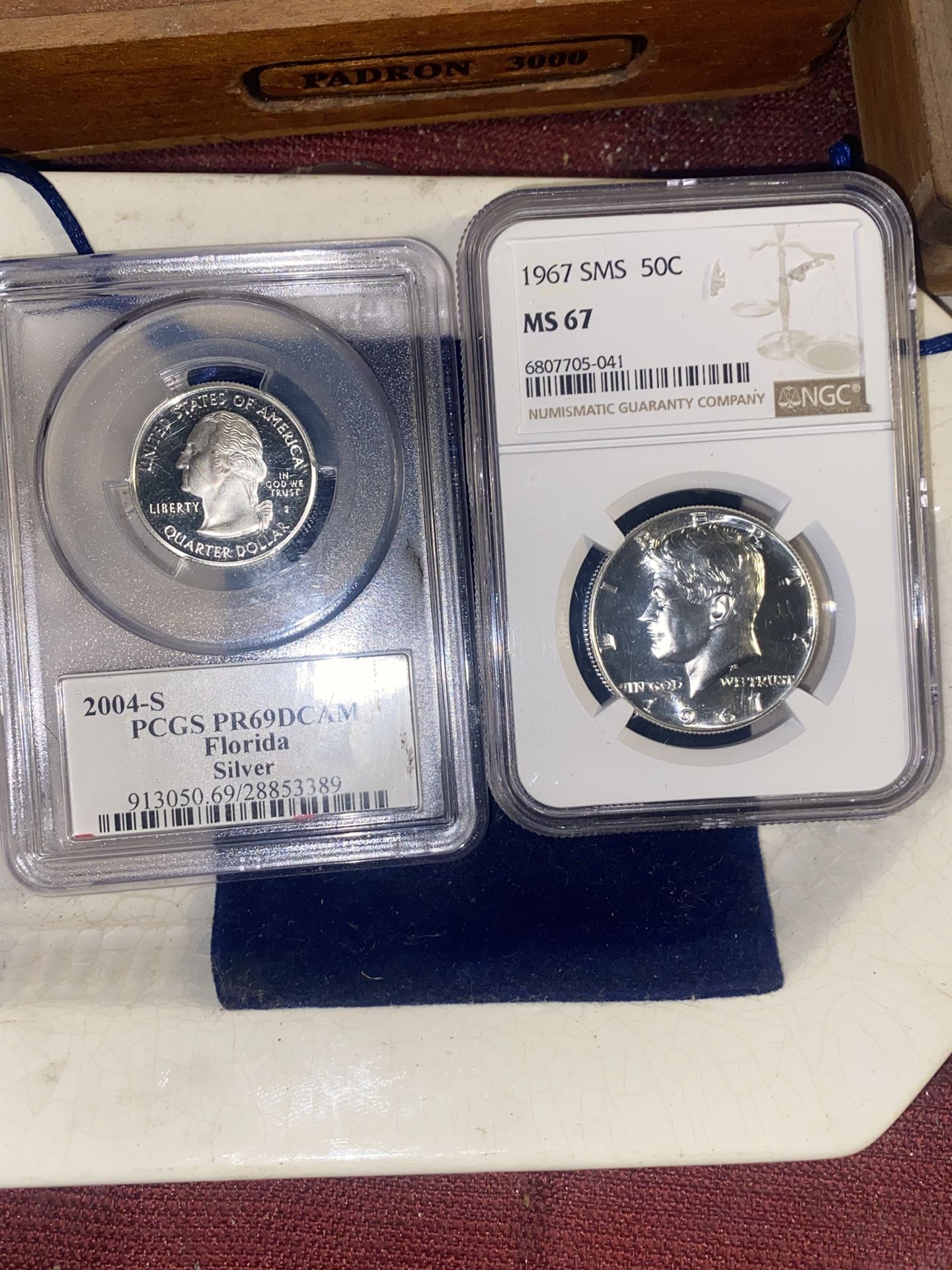 Two slabbed silver coins, 2004 – SPCGS – PR 69D cameo Florida 1967 – SMS – 50 Cent MS 67