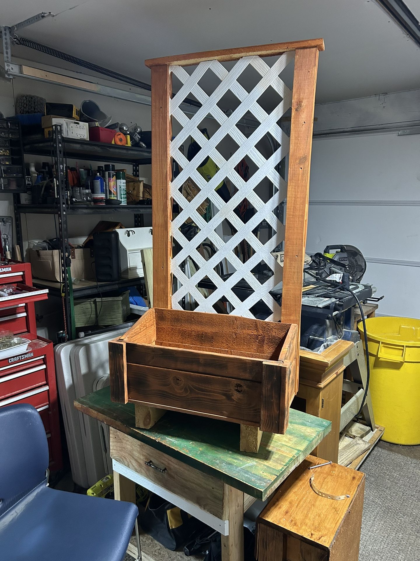 Garden planner with a trellis backdrop