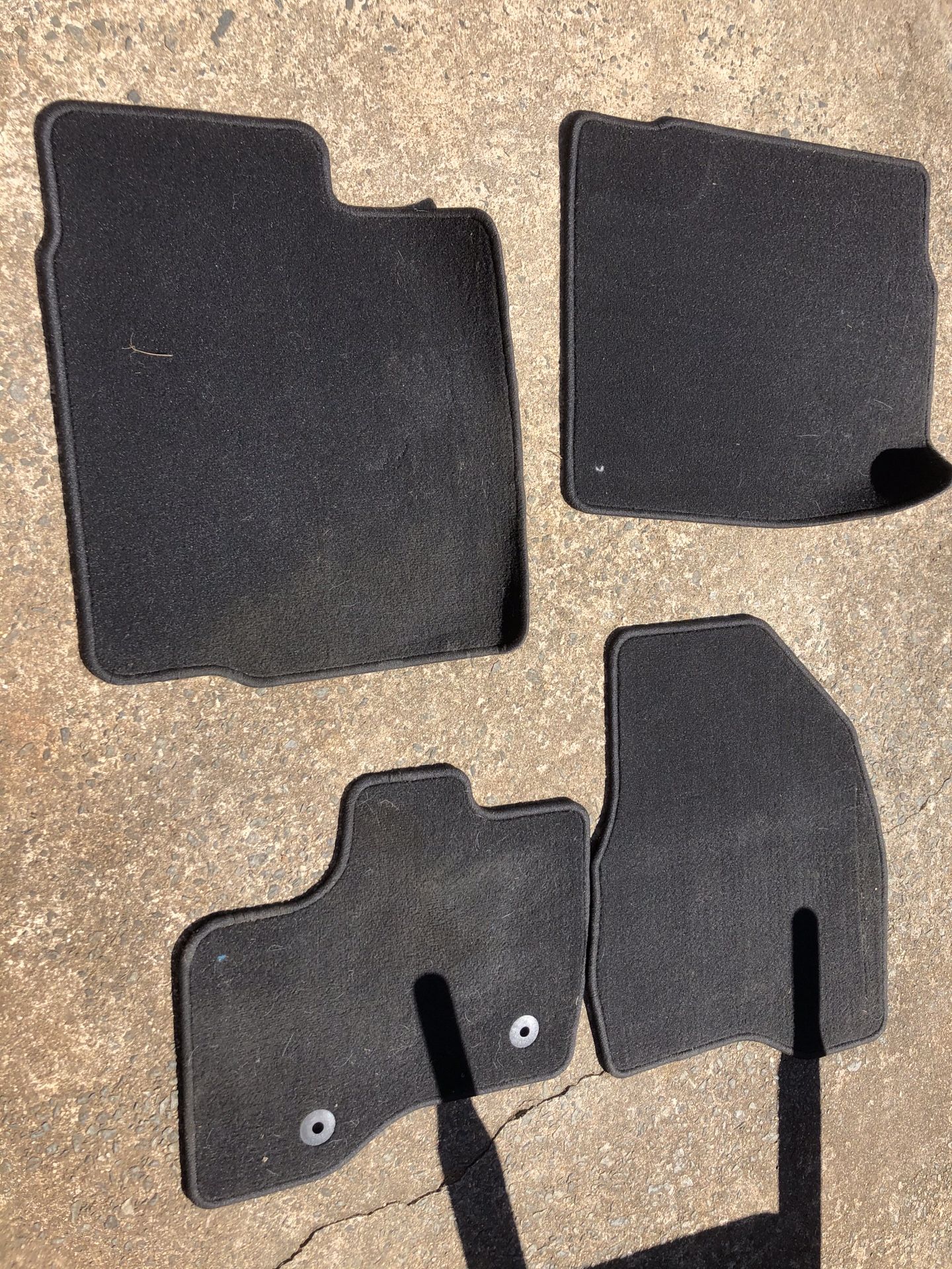 Carpet OEM car mats for a 2013 Ford Explorer.