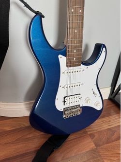 Yamaha Guitar, blue, amplifier, carry case, music book