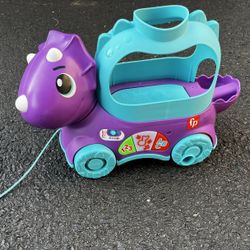 Fisher-Price toddler learning toy poppin’ triceratops dinosaur pull-along toy with music and sounds