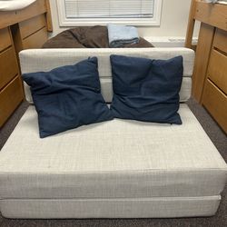 Small beige futon/lounge chair
