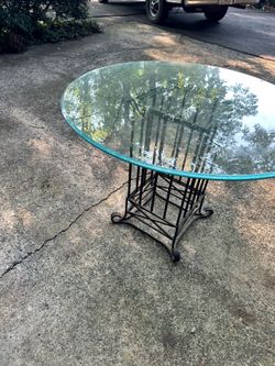 Iron table base with glass top