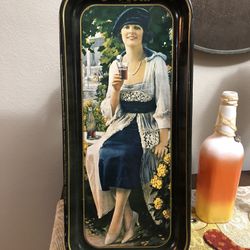 vintage Coca-Cola serving tray, specifically a 1973 reproduction of a 1921 advertisement