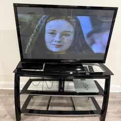 45 Inches Samsung  Television With Remote Control And Tv Stand With Three Glass Shelves . It Has 2 HDMI And 1 USB Port. $100.00 Or Best Offer For Both