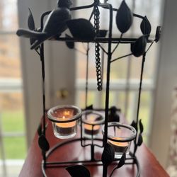 Black metal hanging bird and candle lantern