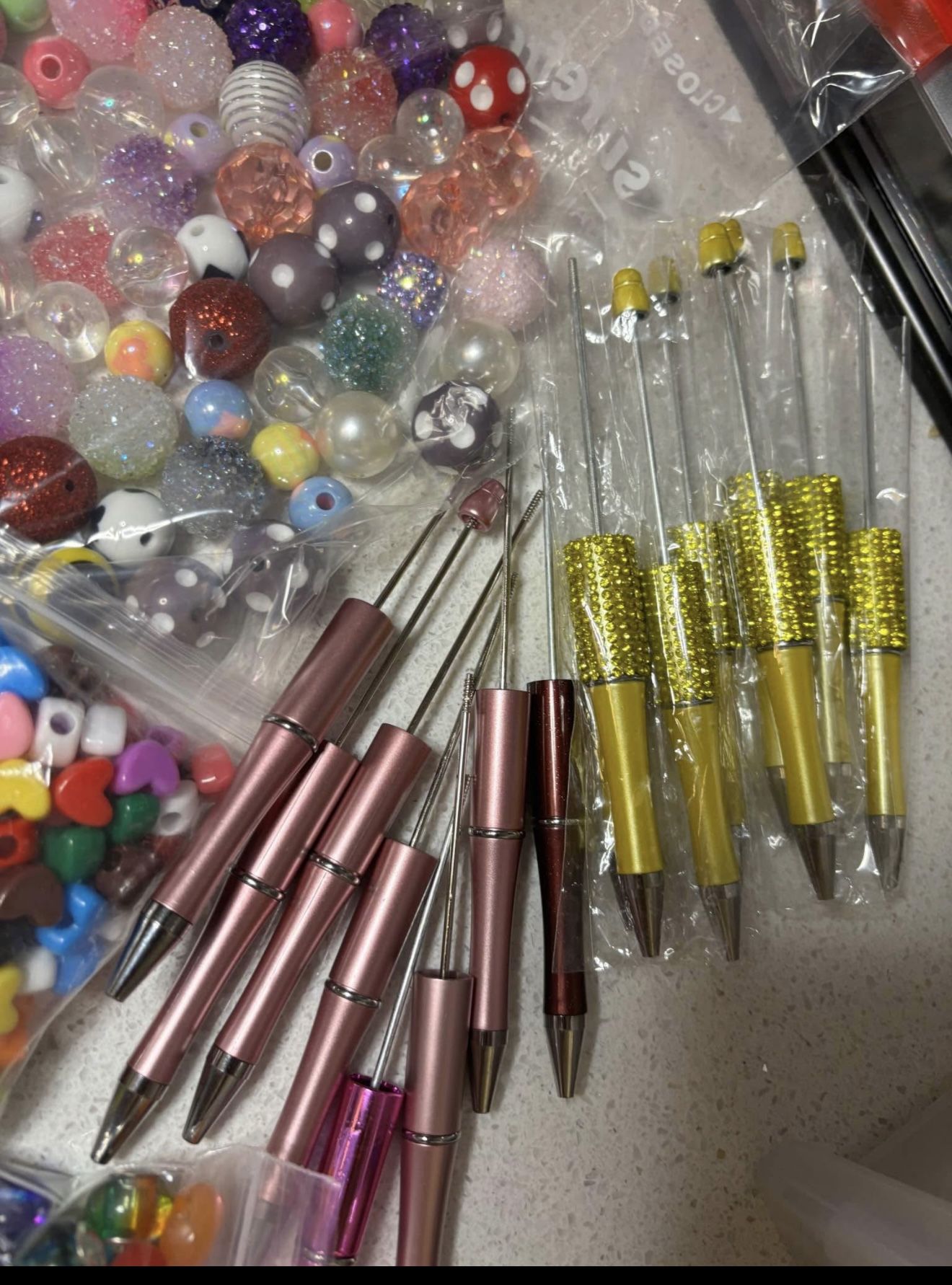 Bundle of beads , spacers and 16 pens