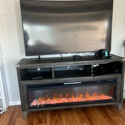 small sectional and 65inch curve tv with fireplace stand!