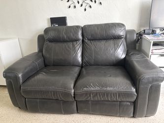 Black leather sofa and reclining loveseat
