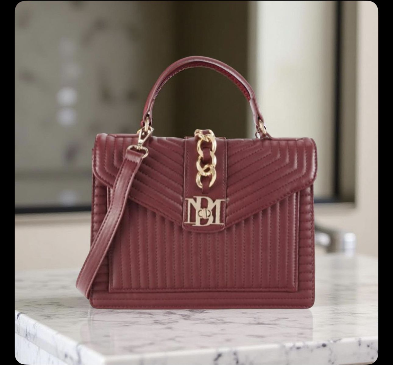 Badgley Mischka Kelly Quilted Crossbody Bag in a wine or burgundy vegan leather finish