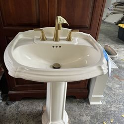 Off white Kohler pedestal sink & Faucet 