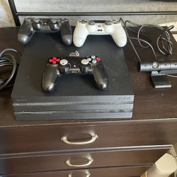 Playstation 4 pro with 3 controllers and a ps4 camera