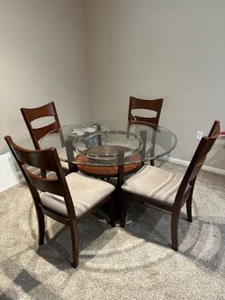 Glass table with 4 chairs