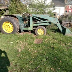 Old Diesel John Deere With The Front Loading Bucket