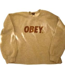 Obey Vintage Crewneck Sweater Size S  Selling $15  Made In ,Mexico Tag  with cheetah print on logo name
