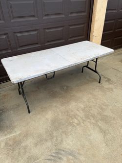 Plastic folding table