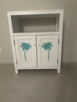 White Wood Cabinet with Palm Tree Design