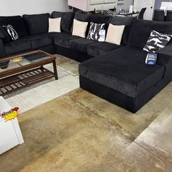 New Black extra-large sectional sofa for sale with delivery and financing.