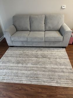 Brand new. Living Spaces grey couch