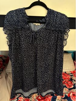 Women’s navy blue polka dot top
