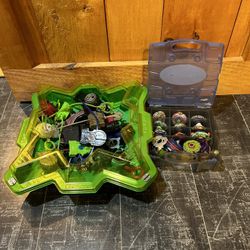 Beyblades, stadium and carrying case.
