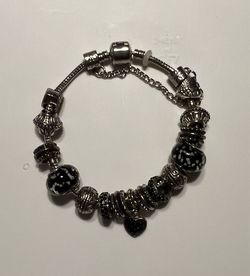 Black and silvertone charm bracelet