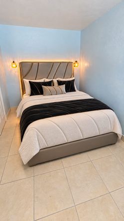 Gray king bed with mattress
