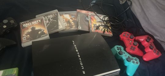 PlayStation 3 Console with Controllers and Games