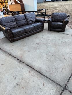Brown Leather Couch And Chair Setup 